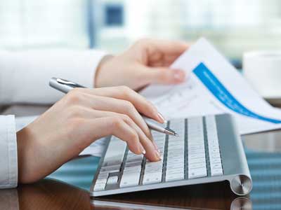 A woman doing bookkeeping services in Beavercreek Ohio
